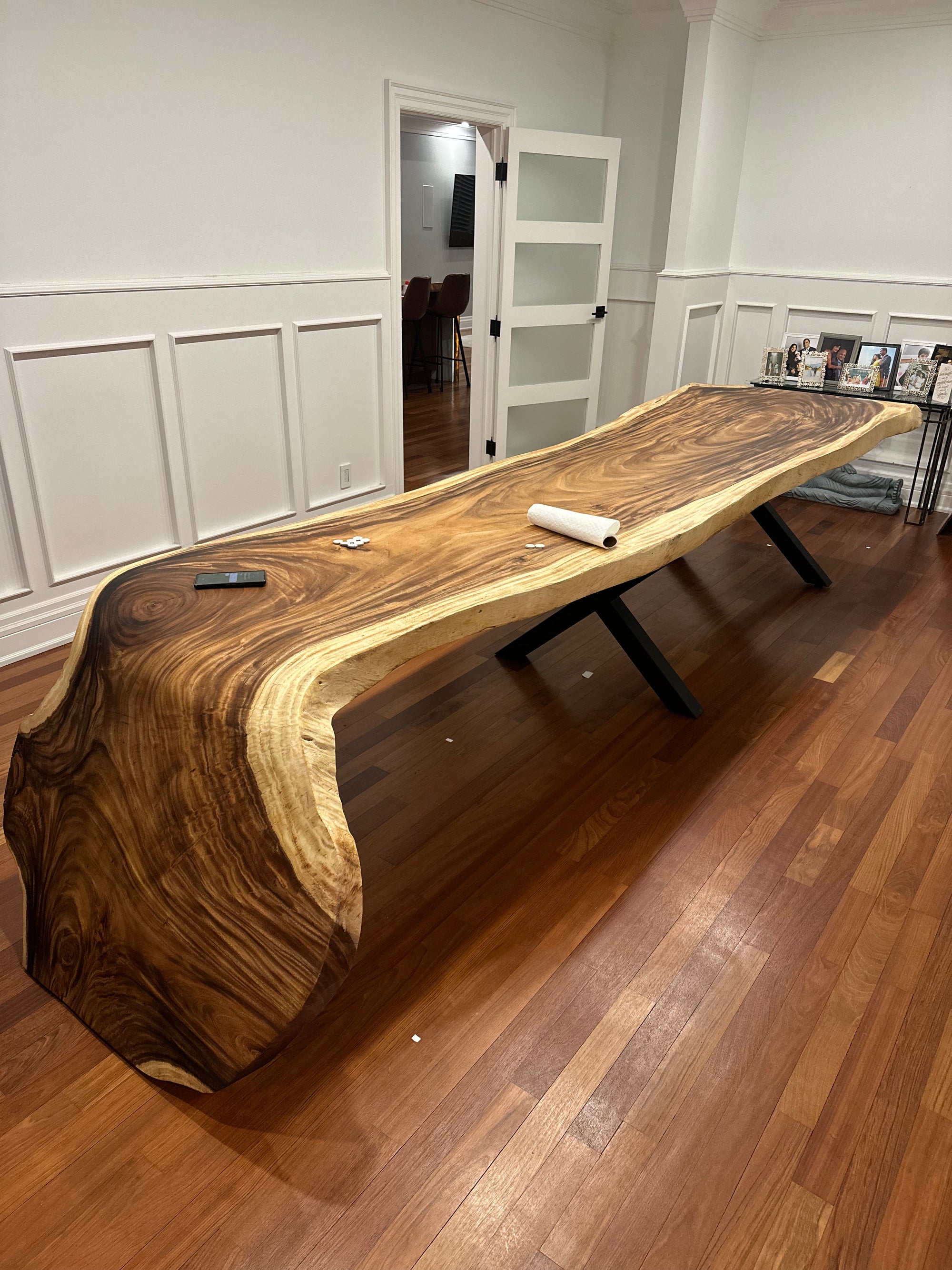 Handcrafted wood dining table with elegant base
