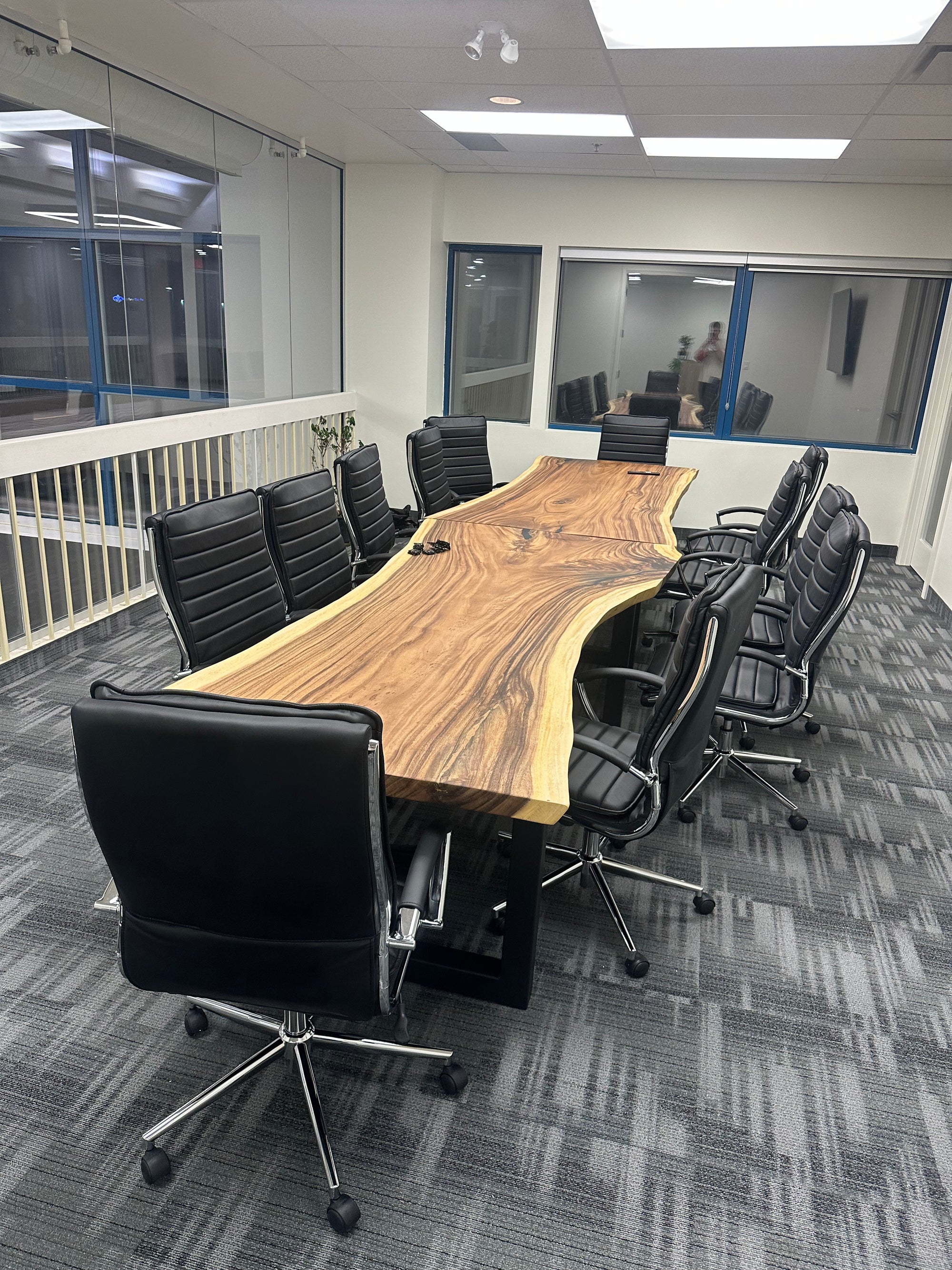 Large live edge dining/boardroom table in a modern office space