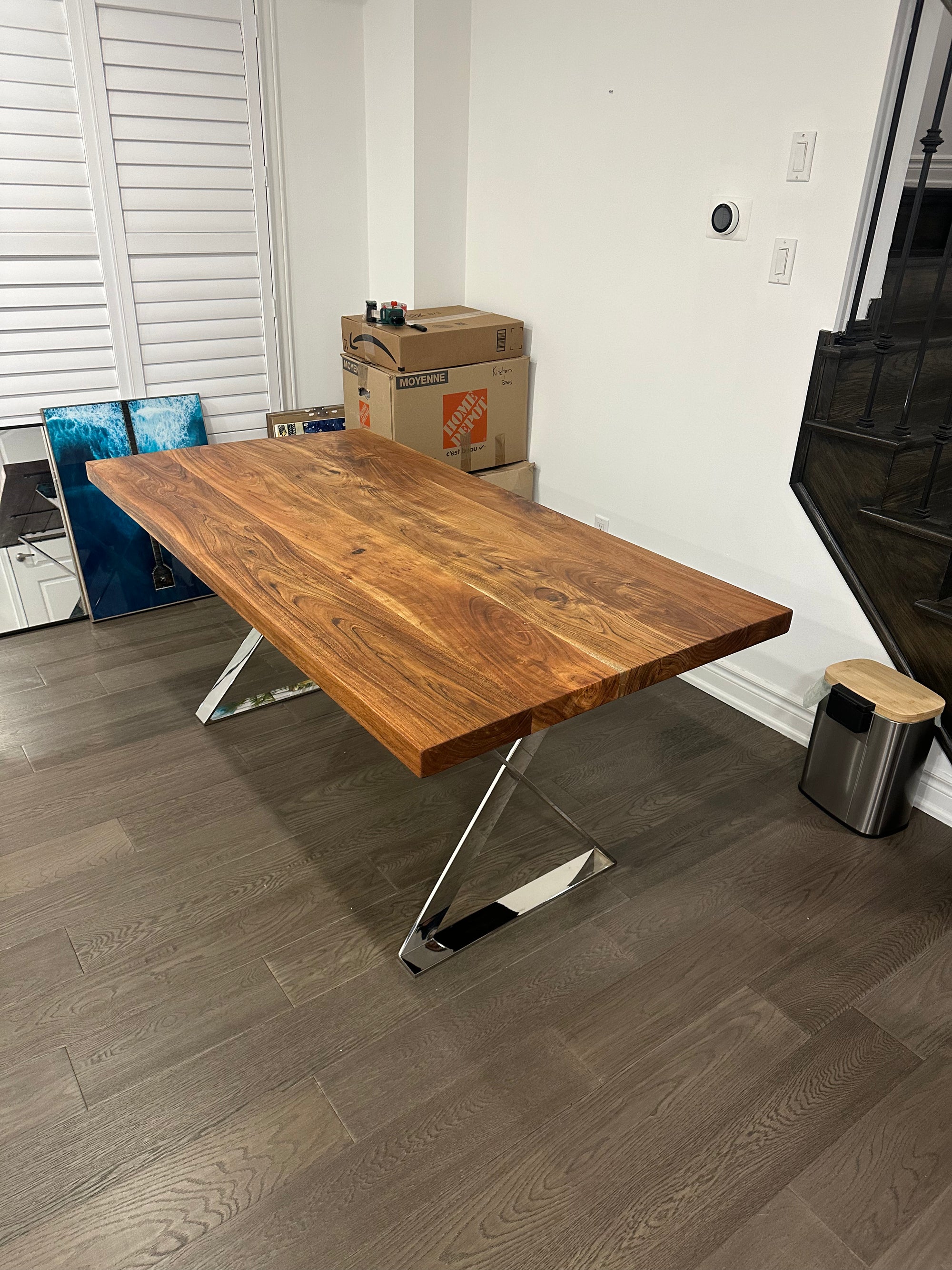Live edge dining table with natural wood grain in a residential setting