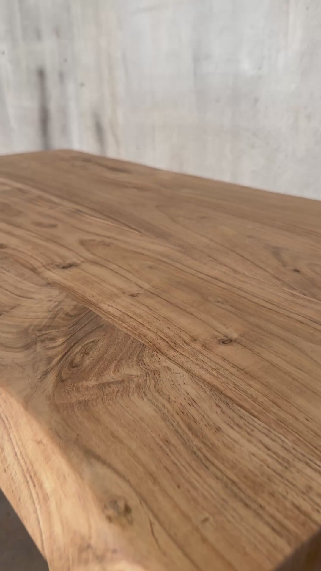 Short product video showing tabletop texture, live edge profile, and base design.