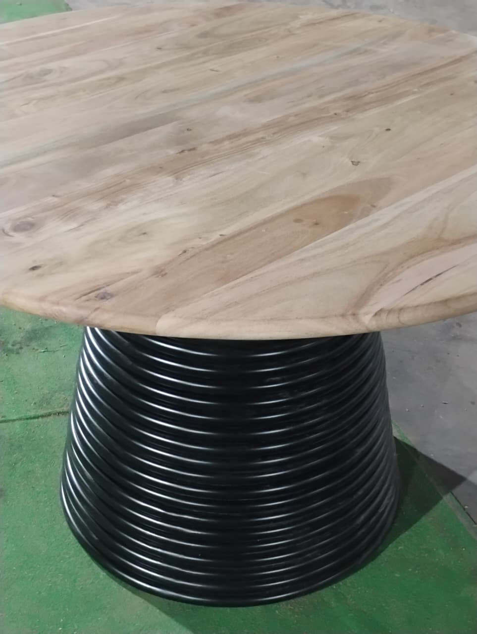 Close up of acacia wood grain on Strata round dining table