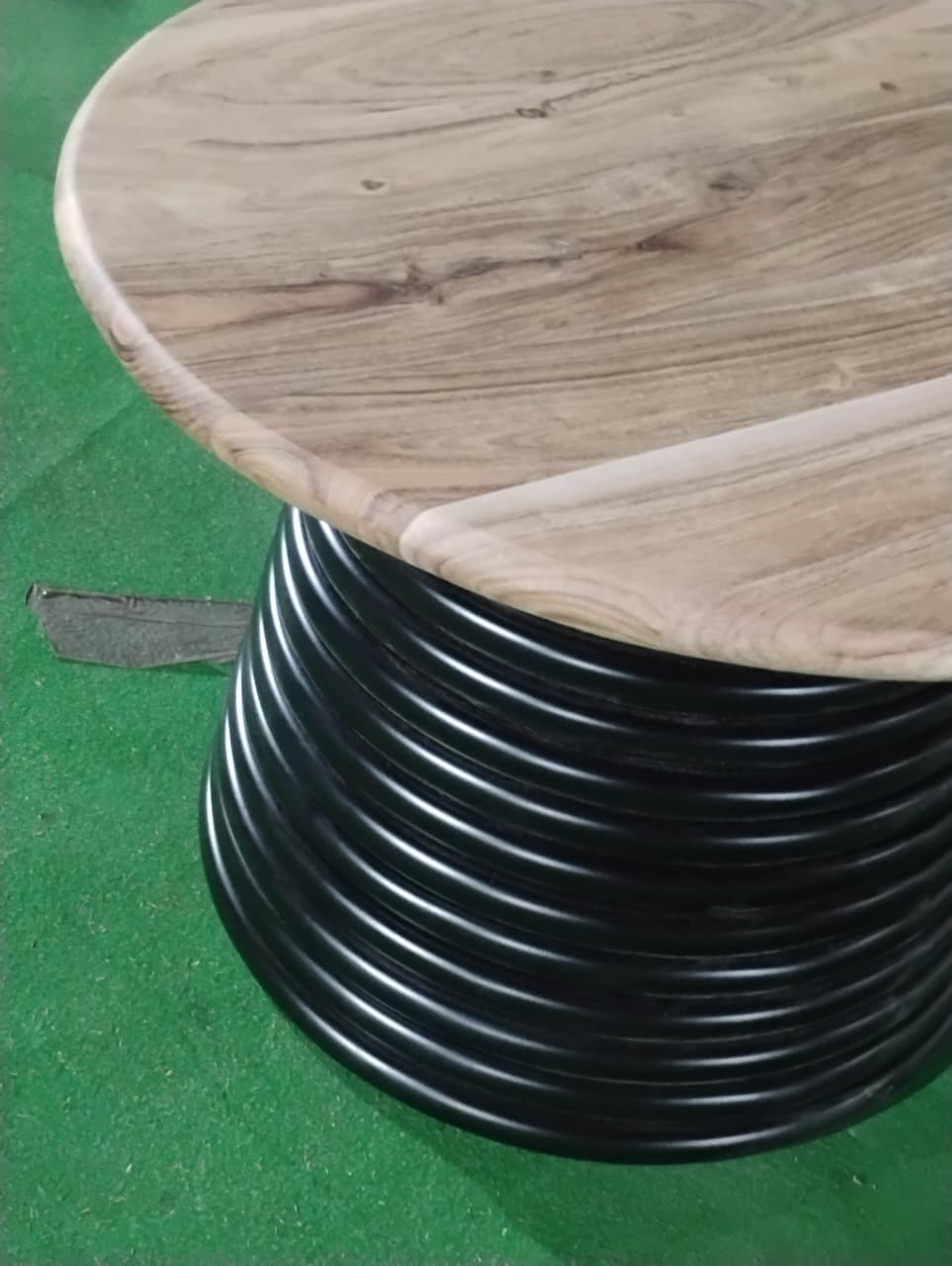 Angled view of Strata round 47 inch dining table with pedestal base